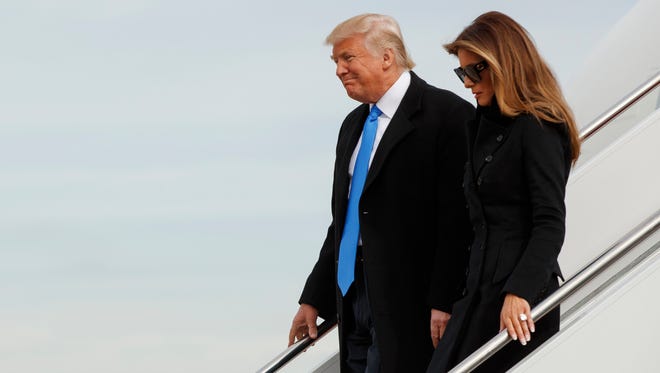 President-elect Donald Trump and his wife, Melania, arrive at Andrews Air Force Base, Md., on Jan. 19, 2017, ahead of Friday's inauguration.