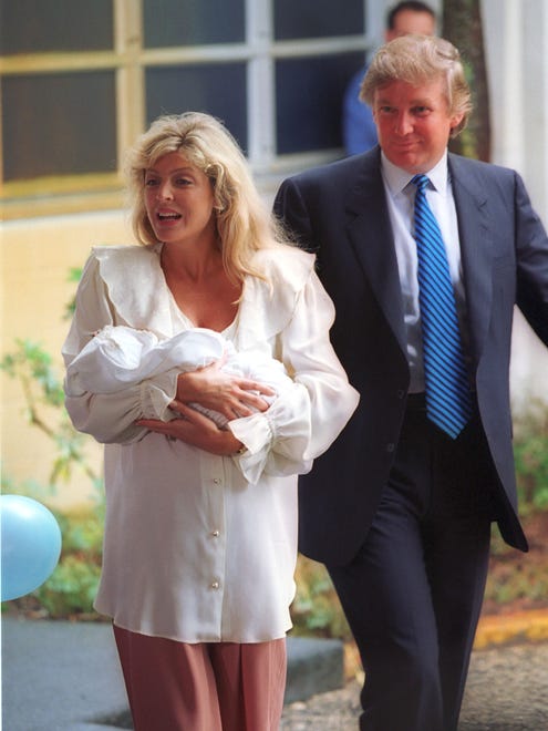 In this Oct. 14, 1993, file photo, Marla Maples and Donald Trump leave St. Mary's Hospital in West Palm Beach, Fla., with their newborn baby girl, Tiffany.
