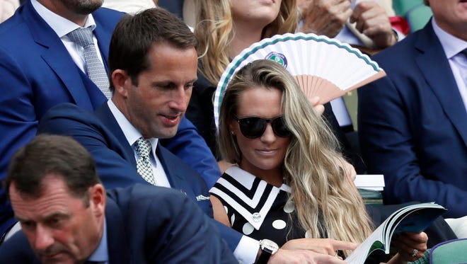 Sir Ben Ainslie and his wife Georgie sit in the Royal Box on Center Court.