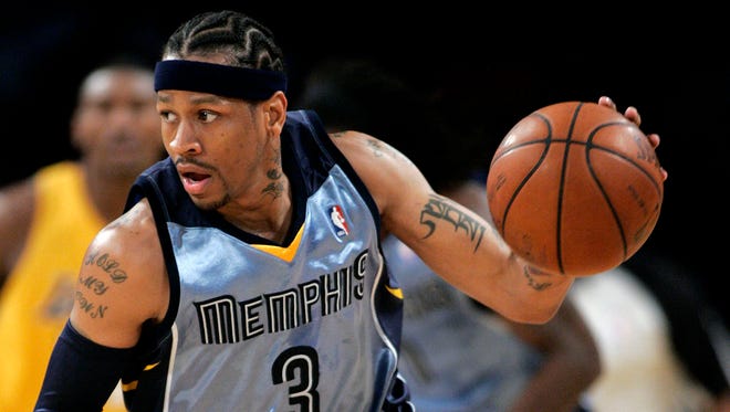 Allen Iverson brings the ball upcourt against the Los Angeles Lakers.