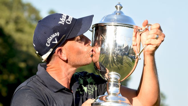 Aug 20, 2017; Greensboro, NC, USA; Henrik Stenson poses with the Sam Snead Trophy after winning the Wyndham Championship golf tournament at Sedgefield Country Club. Mandatory Credit: Rob Kinnan-USA TODAY Sports