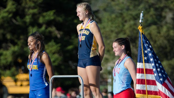 Runner-up Kiersten Walker (from left) of Milwaukee King, winner Brooke Jaworski of Wausau West and third-place Kayla Vogt of Arrowhead share the podium after completing the girls 400 meters with the three fastest times in the state so far this season.