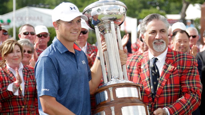 Jordan Spieth holds the Marvin Leonard trophy with Colonial Country Club president Rob Hood after winning the 2016 Dean & Deluca Invitational at Colonial Country Club.