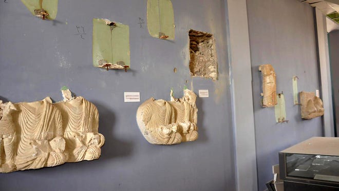 Destroyed statues at the damaged Palmyra Museum, in Palmyra city, central Syria.