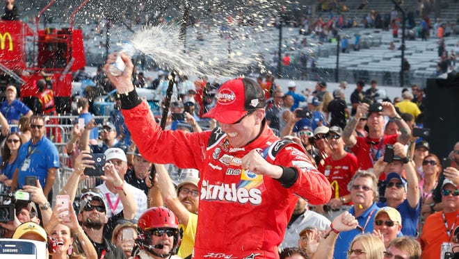 Kyle Busch celebrates after winning the 2016 Brickyard 400 at Indianapolis Motor Speedway for his fourth victory of the season.