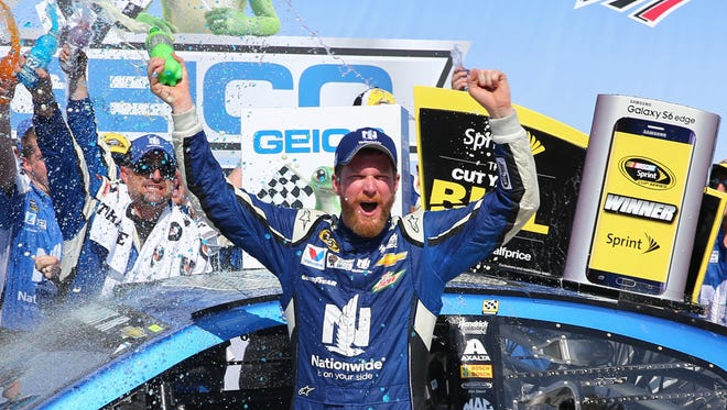 Earnhardt Jr. celebrates his victory in the Geico 500 at Talladega Superspeedway in May 2015, 11 years after his last win there.