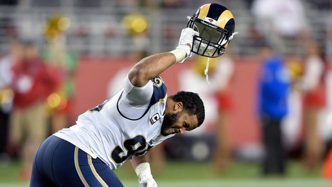 Rams defensive tackle Aaron Donald slams his helmet in anger after being ejected late in the fourth quarter.