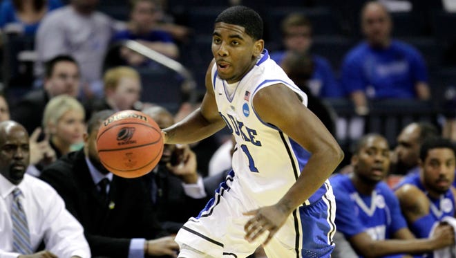 2011: Kyrie Irving moves the ball against Hampton in the second half of an NCAA tournament game.