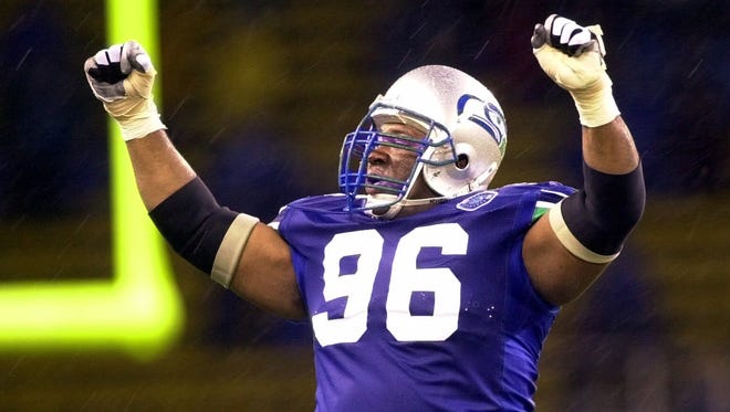 Seattle Seahawks defensive tackle Cortez Kennedy celebrates a victory over the Oakland Raiders in 2000.