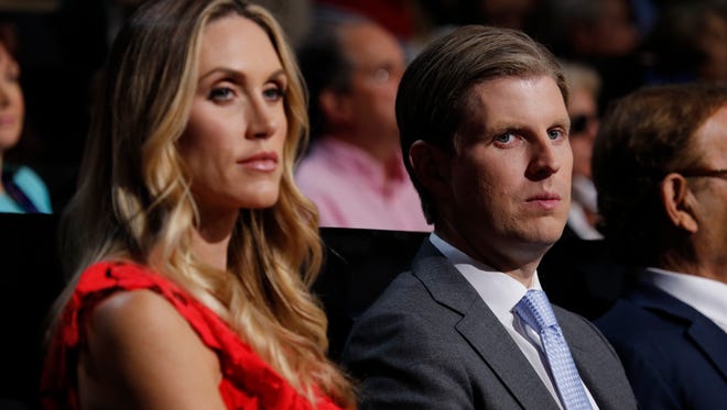 Eric Trump and his wife, Lara Yunaska, listen to the speeches during the Republican National Convention on July 19, 2016.