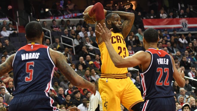 Cleveland Cavaliers forward LeBron James (23) passes over Washington Wizards forward Otto Porter Jr. (22) during the first quarter at Verizon Center.