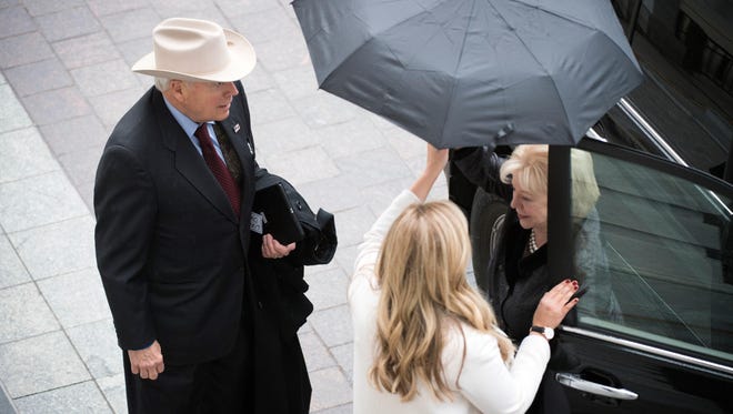 Former Vice-President Dick Cheney and wife Lynne arrive before the inauguration.
