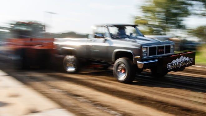 A driver speeds past in the Badger Truck Pull event at the annual Ixonia Town and Country Days Festival hosted by the Ixonia Lions Club on Saturday, August 19, 2017.