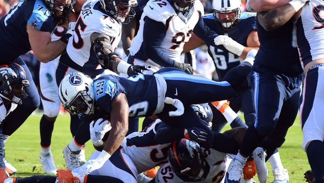 Tennessee Titans running back DeMarco Murray (29) dives for a touchdown during the first half against the Denver Broncos at Nissan Stadium.