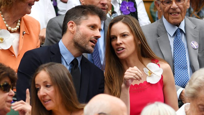 Actress Hilary Swank looks on from the Centre Court royal box on day twelve.