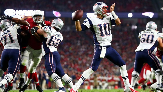 New England Patriots quarterback Jimmy Garoppolo (10) throws a pass in the second quarter against the Arizona Cardinals.