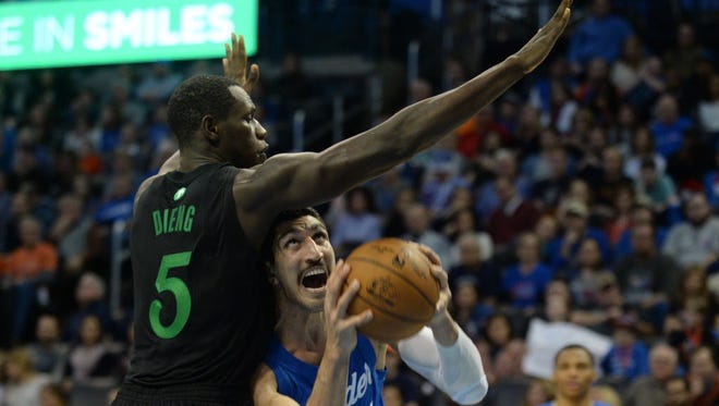 Thunder center Enes Kanter (11) is fouled on a shot by Timberwolves forward Gorgui Dieng (5) during the fourth quarter.