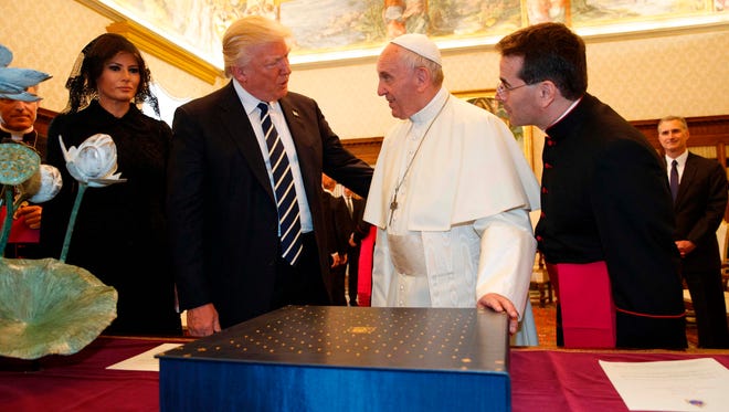 Pope Francis exchanges gifts with President Trump and  first lady Melania Trump during a private audience at the Vatican on May 24, 2017.