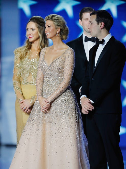 Ivanka Trump and husband Jared Kushner smile on stage with Eric Trump and wife  Lara Trump, left,  at the Freedom Inaugural Ball at the Washington Convention Center  in Washington.