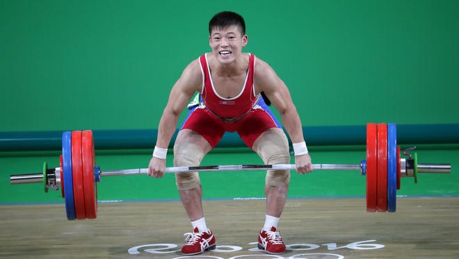 Yong Gwang Kwon of North Korea competes in the men's 69kg weightlifting event at Riocentro - Pavilion 2 during the Rio 2016 Summer Olympic Games.