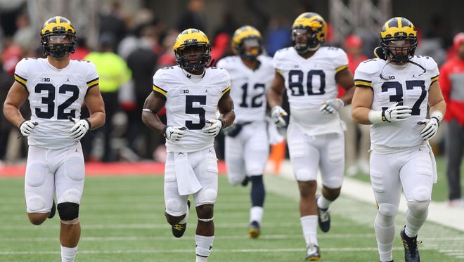 Michigan, led by Jabrill Peppers (5), takes the field for the game against Ohio State on Saturday, Nov. 26, 2016 at Ohio Stadium in Columbus, Ohio.