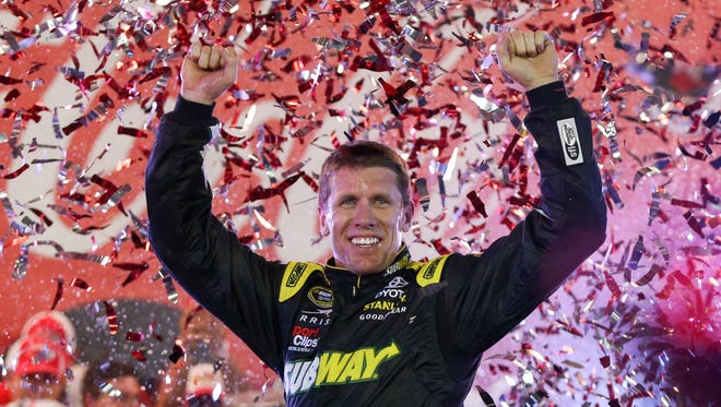 Carl Edwards celebrates after winning the Coca-Cola 600 for his first victory of 2015 and first with Joe Gibbs Racing.