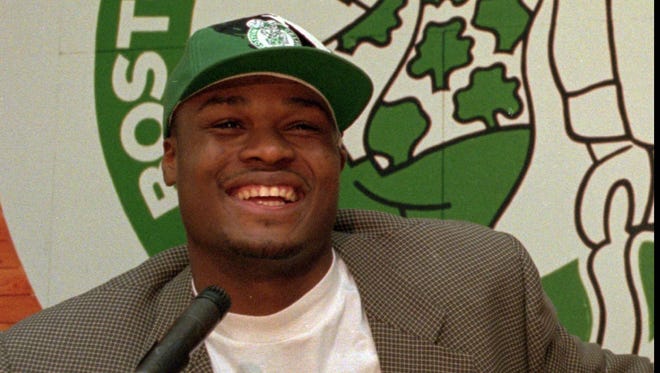 1996: Antoine Walker smiles as he answers questions from members of the media at a news conference.