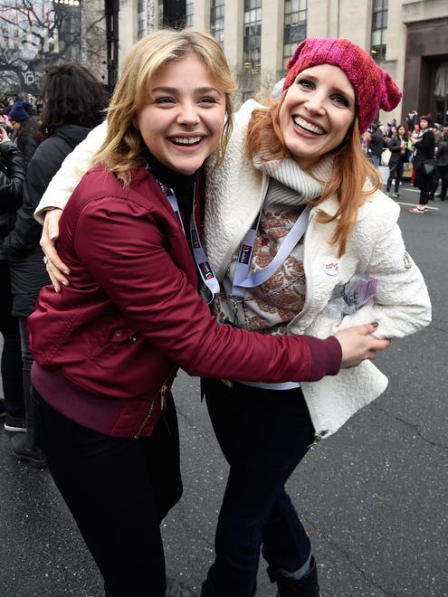 Chloe Grace Moretz, left, and Jessica Chastain hug it up Saturday at the  Women's March on Washington.