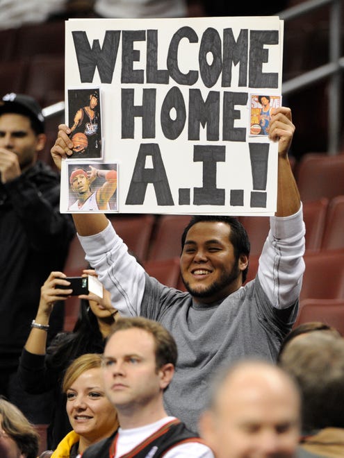 Marc Miranda of Philadelphia, PA holds up a sign to welcome Allen Iverson during pre-game warm ups as Iverson returns to the Philadelphia 76ers.