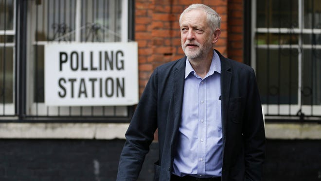 Britain's Labour Party leader Jeremy Corbyn smiles as he arrives to cast his vote in the EU referendum at a polling station in Islington, north London.
