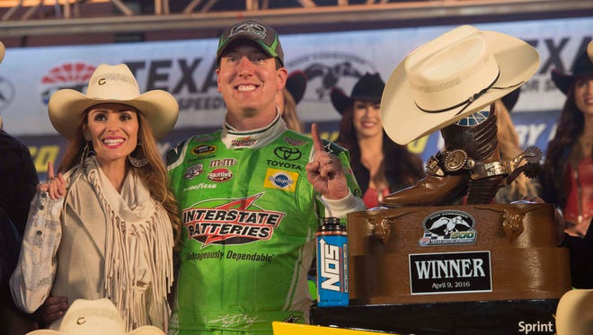 April 9: Kyle Busch, with his wife Samantha, left, wins the Duck Commander 500 at Texas Motor Speedway.
