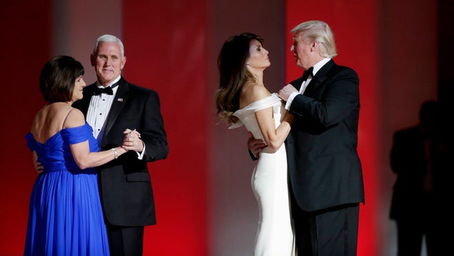 Vice President Mike Pence and President Donald Trump dance with their wives at the Liberty Inaugural Ball in Washington.