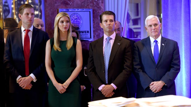 Trump's children Eric, Ivanka, and Donald Jr., along with Vice Preisdent-elect Mike Pence, look on during as the president-elect speaks during his press conference on Jan. 11, 2017, at Trump Tower in New York.