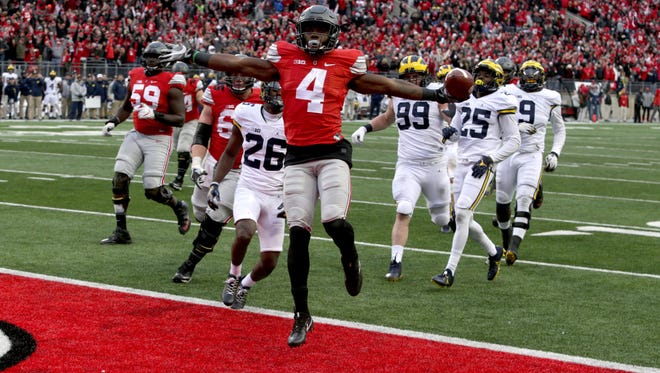 Ohio State's Curtis Samuel jumps for joy and into the end zone in the second overtime for an Ohio State win 30-27 over Michigan at Ohio Stadium on Saturday, Nov. 26, 2016.
