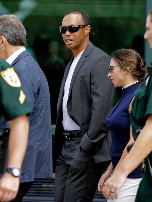 Tiger Woods leaves the Palm Beach County courthouse after his DUI hearing.