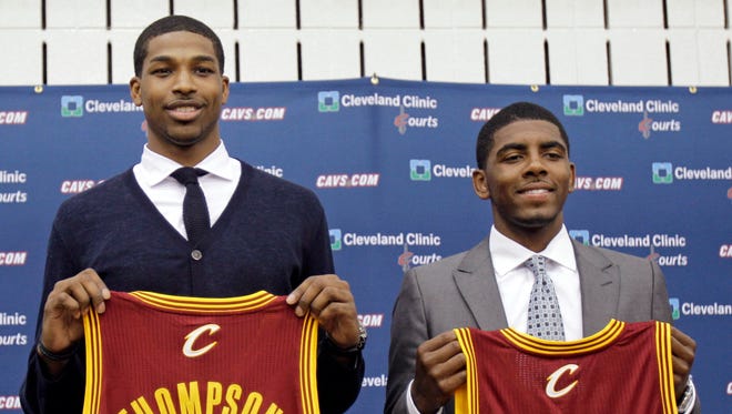 2011: Tristan Thompson and Kyrie Irving hold up Cleveland Cavaliers jerseys.