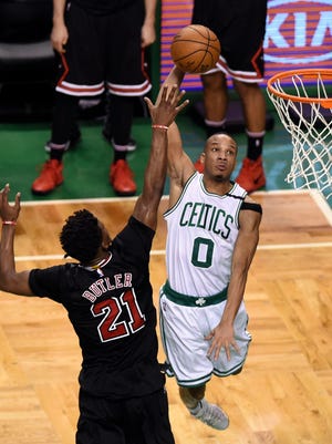 Boston Celtics guard Avery Bradley (0) goes to the basket past Chicago Bulls forward Jimmy Butler (21) during the second half in game five of the first round of the 2017 NBA Playoffs.