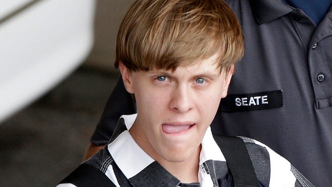 In this June 18, 2015, file photo, Charleston, S.C., shooting suspect Dylann Storm Roof is escorted from the Cleveland County Courthouse in Shelby, N.C.
