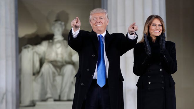 President-elect Donald Trump and his wife Melania Trump arrive at a pre-Inaugural "Make America Great Again! Welcome Celebration" at the Lincoln Memorial in Washington on Jan. 19, 2017.