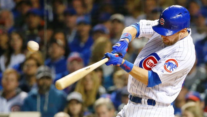 Game 2 at Chicago: Cubs left fielder Ben Zobrist hits an RBI single in the first inning.