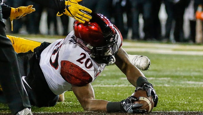 San Diego State running back Rashaad Penny (20) scores a touchdown against Wyoming.