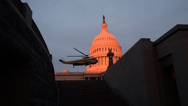 Marine One lands at the U.S. Capitol in the early morning before the 2017 Presidential Inauguration in Washington.