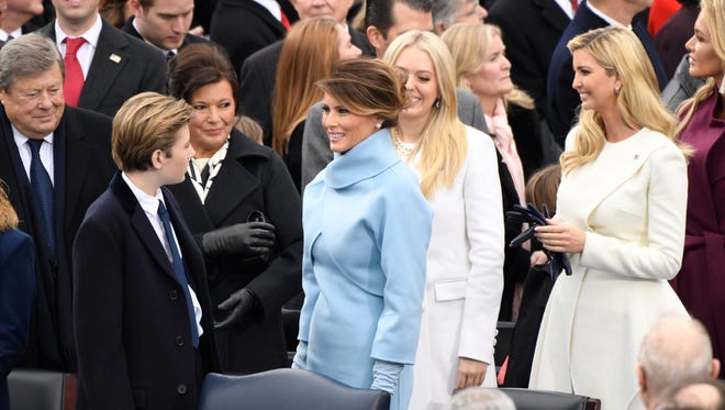 Melania Trump greets Baron Trump as they arrive for the 2017 Presidential Inauguration.
