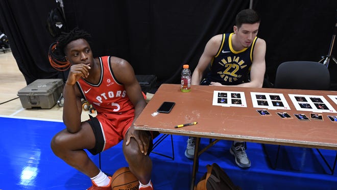 Toronto Raptors' OG Anunoby and Indiana Pacers' T.J. Leaf wait on the next shoot.