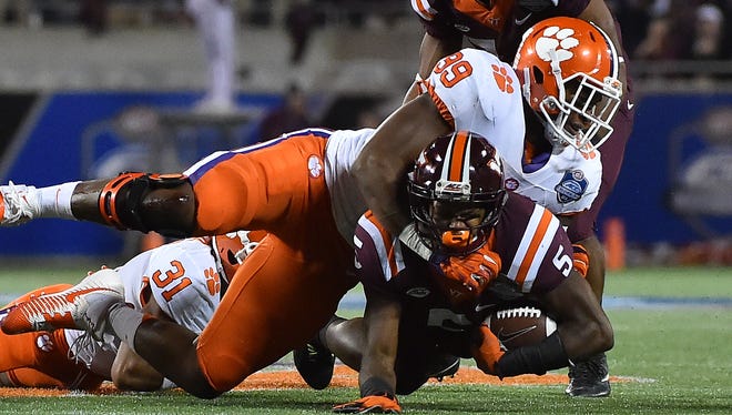 Clemson defensive end Clelin Ferrell tackles Virginia Tech wide receiver Cam Phillips during the ACC Championship Game at Camping World Stadium in Orlando.