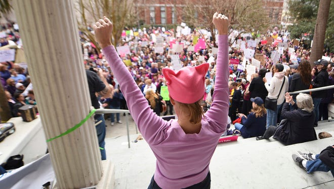 Michele Seidman reacts during a speech at the Women's March next to Wilmington City Hall in Wilmington, N.C., Saturday.