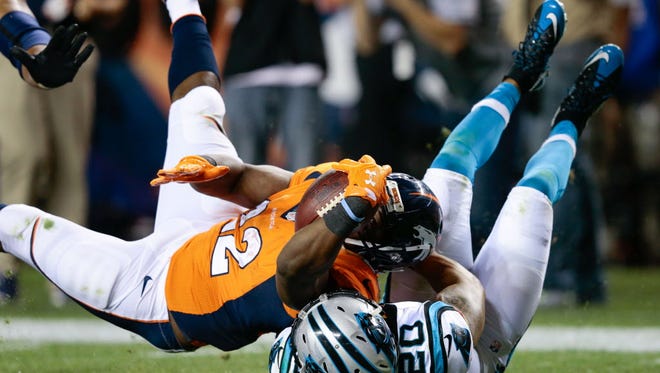 Denver Broncos running back C.J. Anderson (22) dives for a touchdown against the Carolina Panthers.