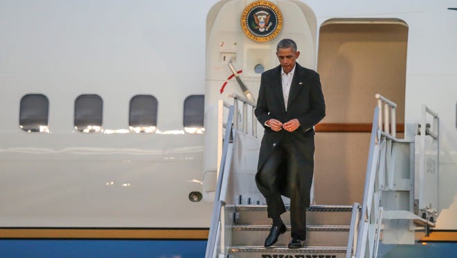 Obama arrives at Jacksonville International Airport on Jan. 7, 2017, in Jacksonville, Fla., to attend a staff member's wedding.