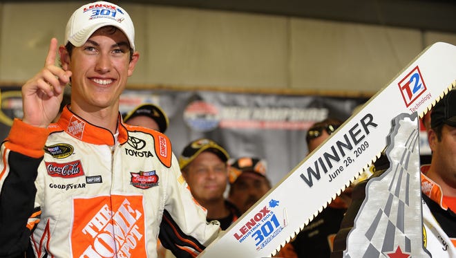 LOUDON, NH - JUNE 28:  Joey Logano, driver of the #20 Home Depot Toyota, celebrates winning the NASCAR Sprint Cup Series LENOX Industrial Tools 301 at New Hampshire Motor Speedway on June 28, 2009 in Loudon, New Hampshire. Logano won the rain shortened race with 27 laps remaining.  (Photo by Drew Hallowell/Getty Images for NASCAR) ORG XMIT: 88620149 GTY ID: 20149JH066_LENOX_Industr