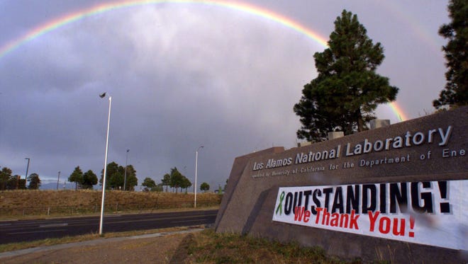 A rainbow hangs over the Los Alamos National Laboratory near Los Alamos, N.M., in June 2000.